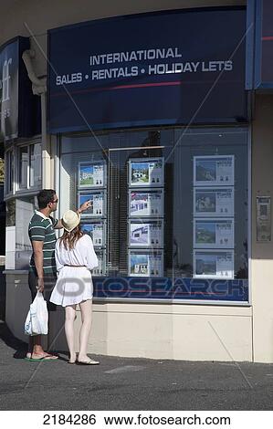 South Africa, Camp's Bay; Cape Town, Couple Looking At Real Estate In Window View Large Photo Image Stock Photograph - South Africa, Camp's Bay; Cape Town, Couple Looking At Real Estate In Window. Fotosearch