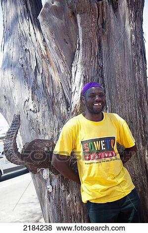 Stock Photo - South Africa, Cape Town, Portrait Of Smiling Man; Kalk Bay. Fotosearch