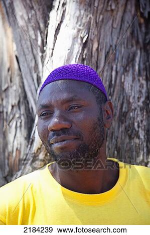 Stock Photo - South Africa, Cape Town, Portrait Of Smiling Man; Kalk Bay. Fotosearch