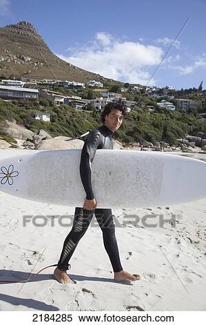 Stock Photography - South Africa, Cape Town, Surfer On Beach; Llandudno. Fotosearch