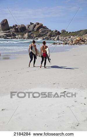 South Africa, Cape Town, Surfers On Beach; Llandudno View Large Photo Image Picture - South Africa, Cape Town, Surfers On Beach; Llandudno. Fotosearch