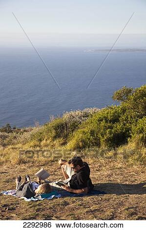 South Africa, Couple Having Picnic On Cliff; Cape Town View Large Photo Image Stock Photograph - South Africa, Couple Having Picnic On Cliff; Cape Town. Fotosearch