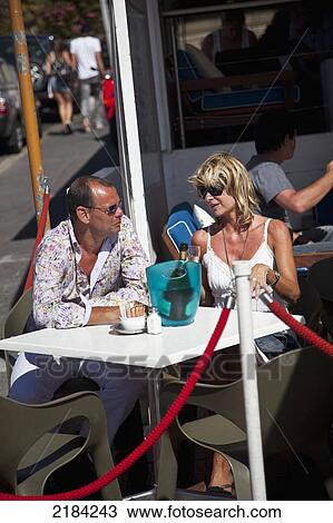 South Africa, Couple Sitting In Sidewalk Cafe; Cape Town View Large Photo Image Stock Image - South Africa, Couple Sitting In Sidewalk Cafe; Cape Town. Fotosearch
