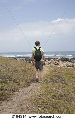 South Africa, Garden Route, Man Walking In Coastal Area; Port Elizabeth View Large Photo Image Picture - South Africa, Garden Route, Man Walking In Coastal Area; Port Elizabeth. Fotosearch