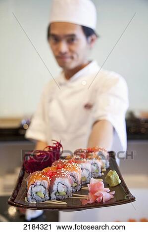 Stock Image - South Africa, Garden Route, Richmond Hill; Port Elizabeth, Chef In Sushi Restaurant. Fotosearch