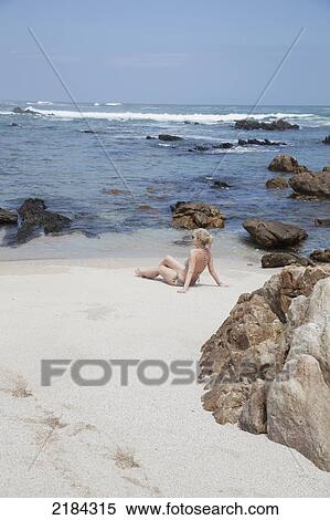 Stock Photography - South Africa, Garden Route, Woman On Beach In Coastal Area; Port Elizabeth. Fotosearch