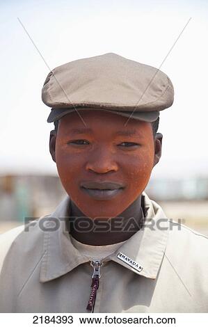 Stock Image - South Africa, Garden Route, Young Xhosa Boy With Face Painted In Coming Of Age Tradition; Port Elizabeth. Fotosearch