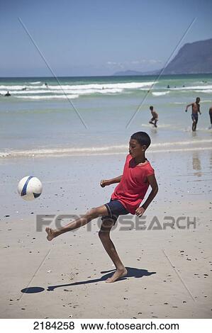 South Africa, Muizenberg; Cape Town, Local Boys Playing Football On Beach View Large Photo Image Stock Photo - South Africa, Muizenberg; Cape Town, Local Boys Playing Football On Beach. Fotosearch