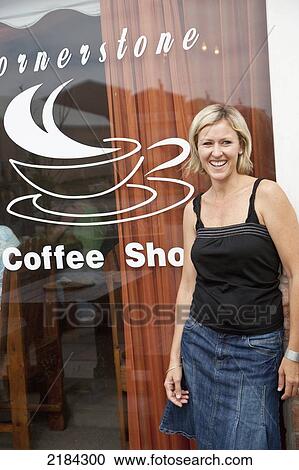 Stock Image - South Africa, Woman In Front Of Local Coffee Shop; Jeffreys Bay. Fotosearch