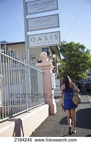 Stock Photography - South Africa, Young Woman Walking On Street; Cape Town. Fotosearch
