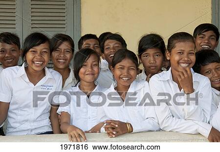 Stock Photograph - South East Asia, Cambodia, Siem Reap, A Group Of Young School Children Gather For A Class Photo.. Fotosearch