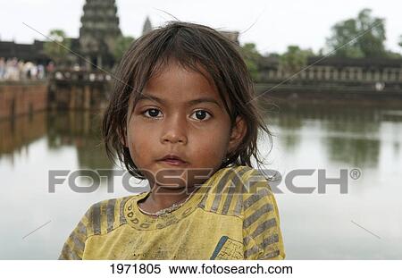 South East Asia, Cambodia, Siem Reap, Portrait Of A Young Local Girl At Angkor Wat. View Large Photo Image Stock Photography - South East Asia, Cambodia, Siem Reap, Portrait Of A Young Local Girl At Angkor Wat.. Fotosearch
