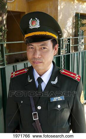 South East Asia, Vietnam, Hanoi, A Policeman Poses For His Portrait. View Large Photo Image Stock Photograph - South East Asia, Vietnam, Hanoi, A Policeman Poses For His Portrait.. Fotosearch