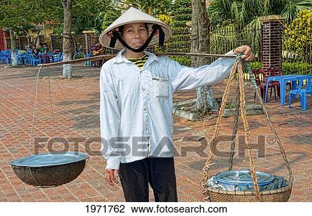 South East Asia, Vietnam, Hanoi, Woman Sells Soup From Basket In Street. View Large Photo Image Stock Image - South East Asia, Vietnam, Hanoi, Woman Sells Soup From Basket In Street.. Fotosearch