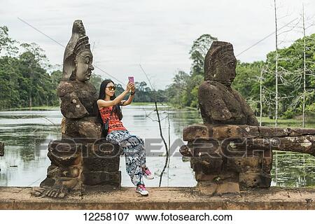 South gate of Angkor, connecting Bayon Wat and Angkor Wat; Siem Reap, Cambodia View Large Photo Image Stock Photo - South gate of Angkor, connecting Bayon Wat and Angkor Wat; Siem Reap, Cambodia. Fotosearch