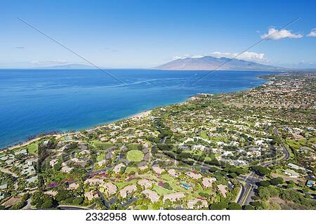 Stock Photo - South Maui coast, Wailea's luxury condos and West Maui mountains in the distance; Maui, Hawaii, United States of America. Fotosearch