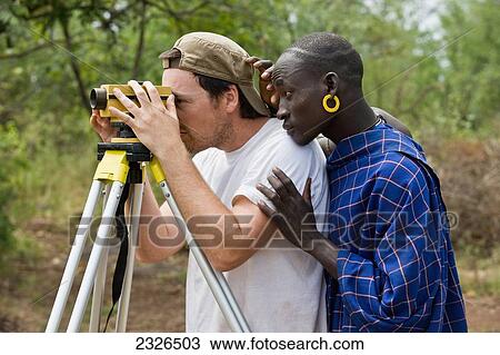 South Western Ethiopia, Omo Valley, Southern Mursiland, Local Mursi warrior with archaeologist; Dirikoro View Large Photo Image Stock Image - South Western Ethiopia, Omo Valley, Southern Mursiland, Local Mursi warrior with archaeologist; Dirikoro. Fotosearch