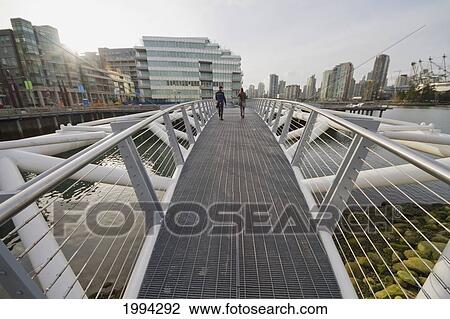 Stock Image - Southeast False Creek Seawall By The Vancouver Olympic Village, Vancouver, British Columbia, Canada. Fotosearch