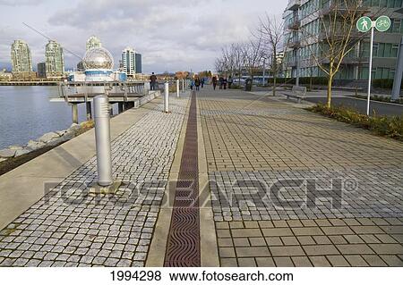 Stock Photo - Southeast False Creek Seawall By The Vancouver Olympic Village, Vancouver, British Columbia, Canada. Fotosearch