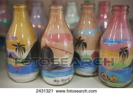 Stock Image - Souvenirs made from sand in bottles, Sugarloaf mountain; Rio de Janeiro, Brazil. Fotosearch