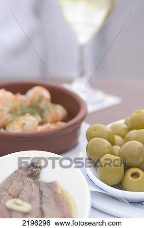 Spain, anchovies and prawns) with glass of wine; Barcelona, Tapas (olives View Large Photo Image Stock Photograph - Spain, anchovies and prawns) with glass of wine; Barcelona, Tapas (olives. Fotosearch