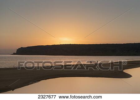 Stock Photo - Spain, Andalusia, Cadiz, Costa de la Luz, Tarifa, Beach at sunset; Bolonia. Fotosearch