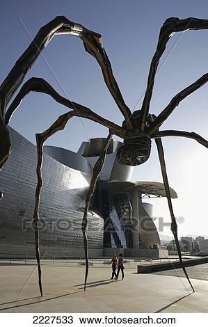 Stock Image - Spain, Basque Region, Giant Manan Spider by Louise Burgeois outside Frank Gehry's Guggenheim Art Museum; Bilbao. Fotosearch