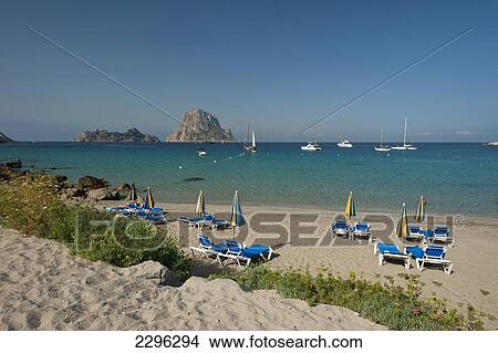 Spain, Cala D'Hort beach with Es Vedra Island behind; Ibiza View Large Photo Image Picture - Spain, Cala D'Hort beach with Es Vedra Island behind; Ibiza. Fotosearch