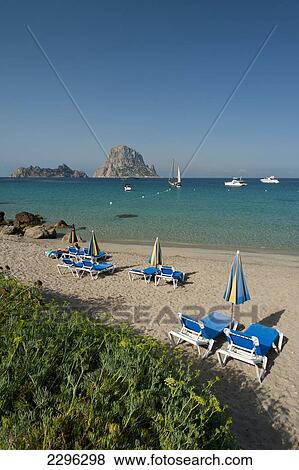 Stock Photo - Spain, Cala D'Hort beach with Es Vedra Island behind; Ibiza. Fotosearch