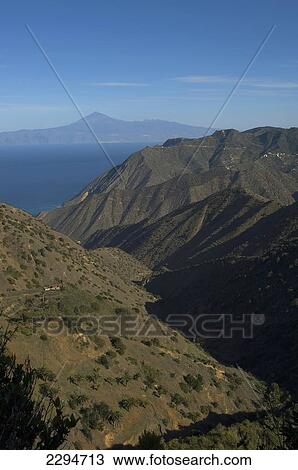 Stock Image - Spain, Canary Islands, Island of Tenerife viewed from Vallehermoso trail; Island of La Gomera. Fotosearch