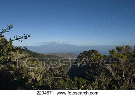 Stock Image - Spain, Canary Islands, Mount Teide and Island of Tenerife viewed from Momumento Natural de los Roques; Island of La Gomera. Fotosearch