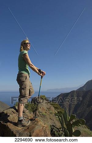 Spain, Canary Islands, Young woman hiking on Vallehermoso trail; Island of La Gomera View Large Photo Image Stock Image - Spain, Canary Islands, Young woman hiking on Vallehermoso trail; Island of La Gomera. Fotosearch