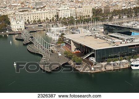 Spain, Catalonia, and Rambla de Mar from Torre Sant Sebastia; Barcelona, View of Port Vell Maremagnum shopping mall View Large Photo Image Stock Photo - Spain, Catalonia, and Rambla de Mar from Torre Sant Sebastia; Barcelona, View of Port Vell Maremagnum shopping mall. Fotosearch