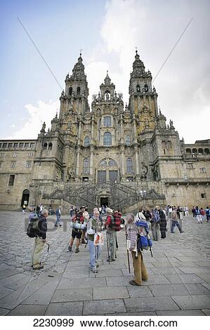 Spain, Galicia, Pilgrims Standing In Plaza Del Obradoiro In Front Of Santiago De Compostela Cathedral; Santiago De Compostela View Large Photo Image Stock Photo - Spain, Galicia, Pilgrims Standing In Plaza Del Obradoiro In Front Of Santiago De Compostela Cathedral; Santiago De Compostela. Fotosearch