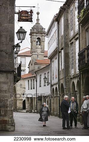Spain, Galicia, Street Scene With Old Men And Nun; Santiago De Compostela View Large Photo Image Stock Photo - Spain, Galicia, Street Scene With Old Men And Nun; Santiago De Compostela. Fotosearch