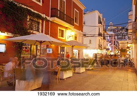 Stock Photo - Spain, Ibiza, Cafes at dusk; Ibiza Town. Fotosearch