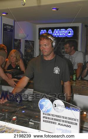 Stock Photo - Spain, Ibiza, DJ using decks; Playa Salinas. Fotosearch