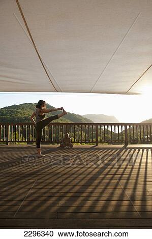 Spain, Ibiza, Lady doing yoga at Ibiza Yoga; Benirras View Large Photo Image Stock Image - Spain, Ibiza, Lady doing yoga at Ibiza Yoga; Benirras. Fotosearch