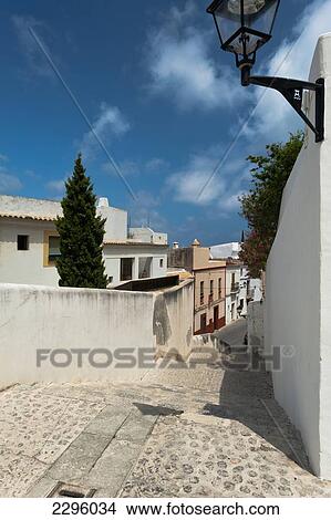 Picture - Spain, Ibiza, Looking down alley in Dalt Vila; Ibiza Town. Fotosearch
