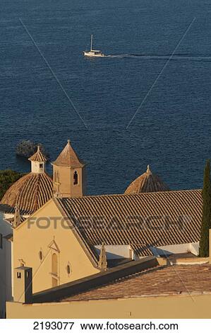 Stock Photo - Spain, Ibiza, Looking over Santo Domingo church in Dalt Vila; Ibiza Town. Fotosearch