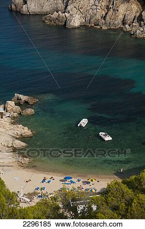 Stock Photography - Spain, Looking down onto Cala d'en Serra beach; Ibiza. Fotosearch