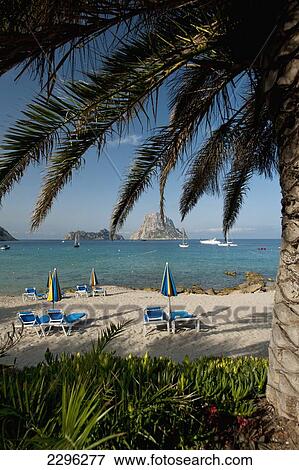 Spain, Looking out to Es Vedra Island from Cala d'Hort beach; Ibiza View Large Photo Image Stock Photo - Spain, Looking out to Es Vedra Island from Cala d'Hort beach; Ibiza. Fotosearch