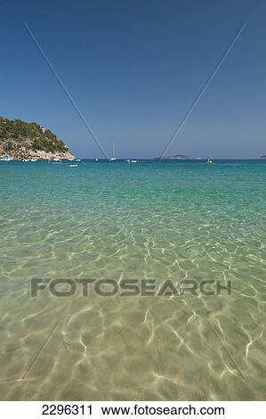 Stock Image - Spain, Looking out to sea from Cala de San Vicente beach; Ibiza. Fotosearch