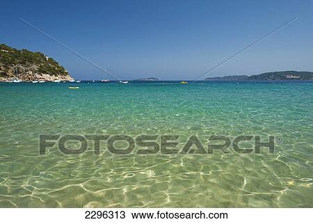 Stock Image - Spain, Looking out to sea from Cala de San Vicente beach; Ibiza. Fotosearch