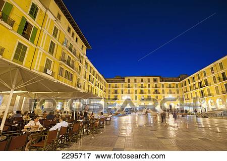 Stock Photo - Spain, Majorca, Cafes and restaurants in Plaza Major at dusk; Palma. Fotosearch