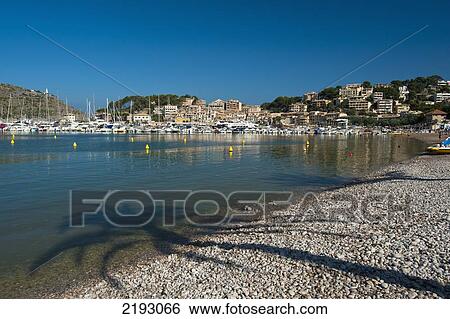 Stock Photograph - Spain, Majorca, Shadows of palm trees on beach; Port Soller. Fotosearch