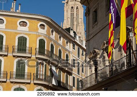 Stock Image - Spain, Majorca, spire of Santa Eulalia church and residential building in Placa de Cort; Palma, 17th Century Town Hall. Fotosearch