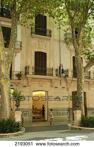 Spain, Majorca, Woman walking past shop on Passeig des Born; Palma View Large Photo Image Stock Image - Spain, Majorca, Woman walking past shop on Passeig des Born; Palma. Fotosearch