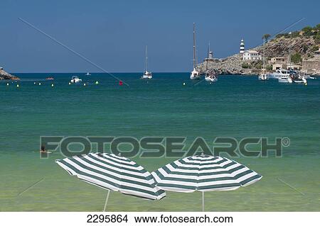 Spain, Pair of beach umbrellas on beach of Port Soller; Majorca View Large Photo Image Picture - Spain, Pair of beach umbrellas on beach of Port Soller; Majorca. Fotosearch