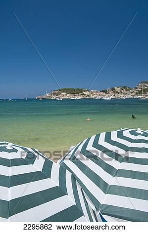 Spain, Pair of beach umbrellas on beach of Port Soller; Majorca View Large Photo Image Stock Image - Spain, Pair of beach umbrellas on beach of Port Soller; Majorca. Fotosearch